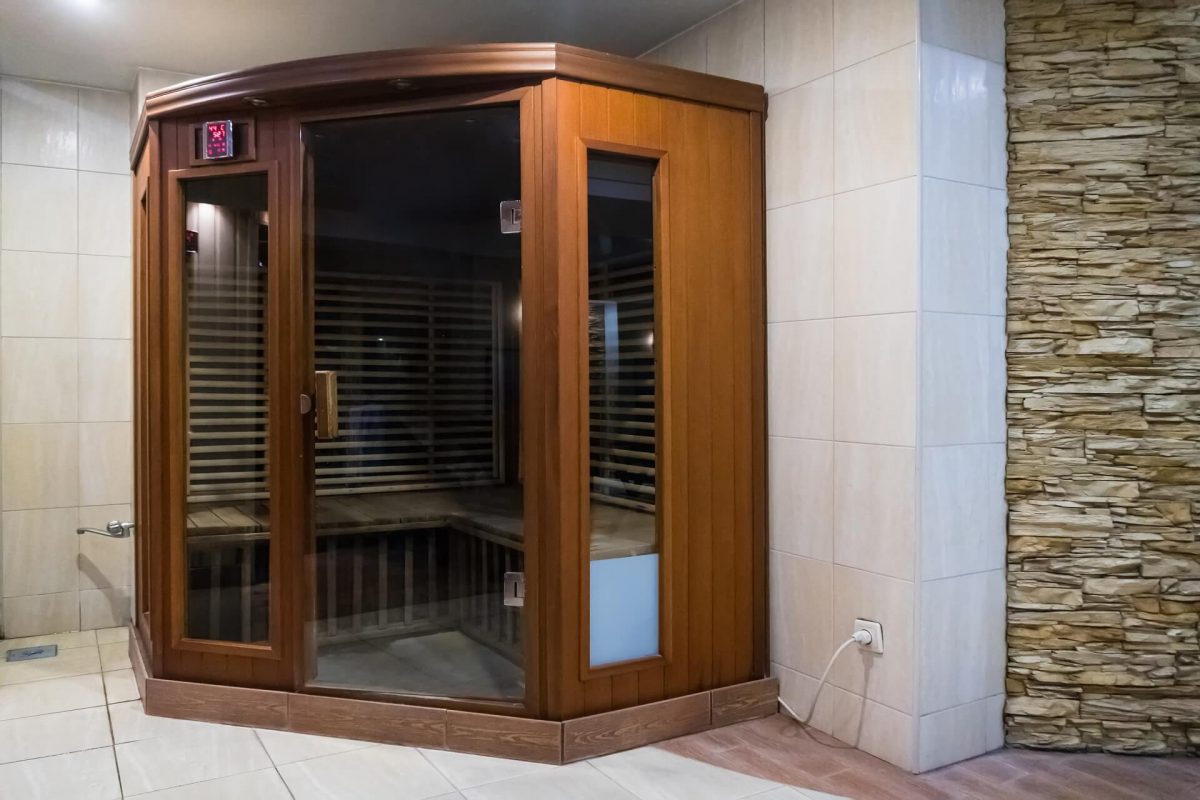 a small wooden infrarered sauna booth in a spa 1